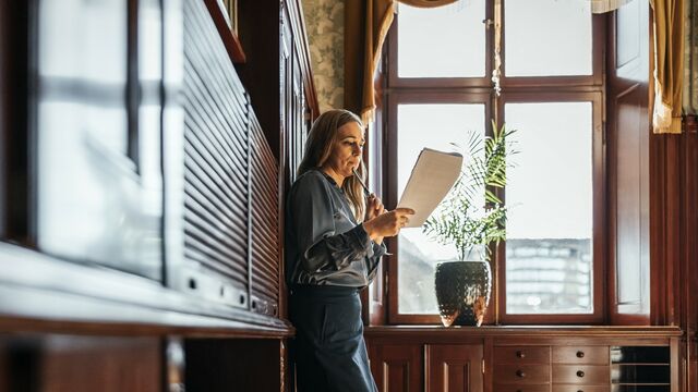 business woman reading small